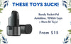 Promotional graphic featuring a black and dark gray cylindrical personal massager device on a white background with blue text reading 'THESE TOYS SUCK!' and 'Randy Pocket Pal Autoblow, TENGA Cups + More BJ Toys! From $15'. Decorative leaf graphics appear in the corners.